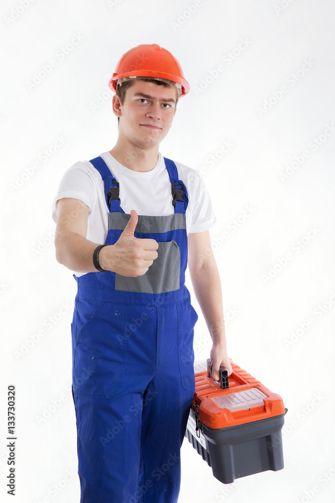 Builder smiling and raised his finger up on a white background Builder smiling and raised his finger up on a white background