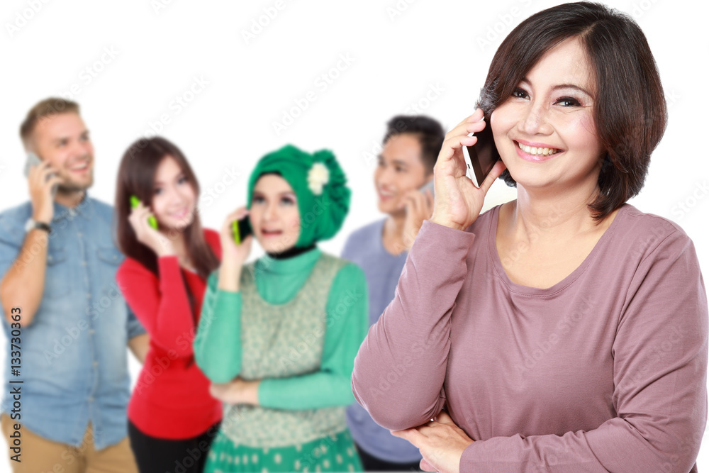 group of people calling using mobile phone group of people calling using mobile phone