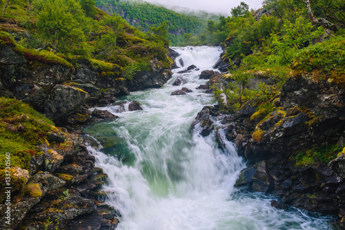 Landscape with views of the largest waterfall. The county of More og Romsdal. Norway