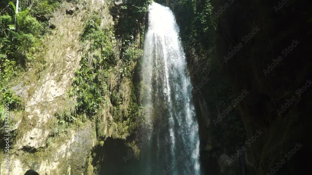 Beautiful waterfall in green forest in jungle. Waterfall in the mountains. Tropical rain forest with waterfall. Philippines, Cebu. 4K video. Travel concept. Beautiful waterfall in green forest in jungle. Waterfall in the mountains. Tropical rain forest with waterfall. Philippines, Cebu. 4K video. Travel concept.