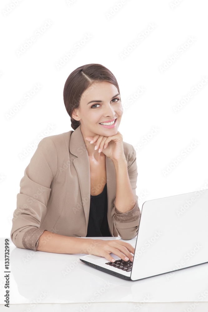 businesswoman smiling while working on her laptop businesswoman smiling while working on her laptop