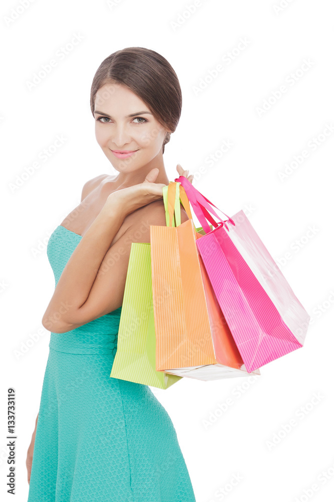 Beauty woman smiling while carrying shopping bags
