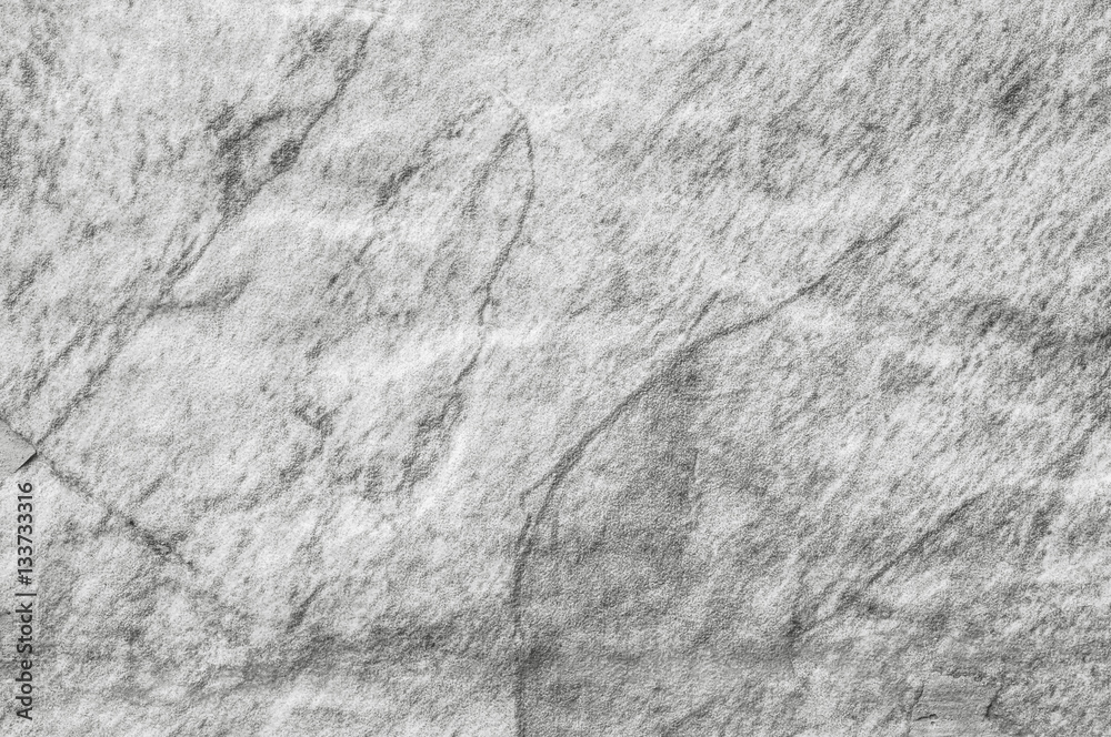 Closeup surface at stone pattern at stone brick wall in the garden textured background in black and white tone Closeup surface at stone pattern at stone brick wall in the garden textured background in black and white tone