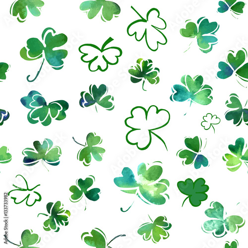 Seamless vector pattern with green shamrocks on white