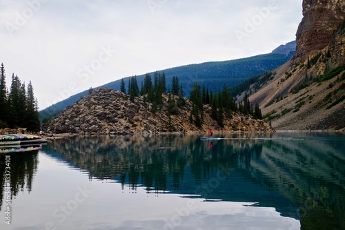 Fototapeta Naklejka Na Ścianę i Meble -  Paddle board in lake. Moraine Lake. Banff National Park. Canadian Rockies. British Columbia. Canada.