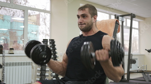 Male bodybuilder training hands. Preparing for the competition. Healthy lifestyle