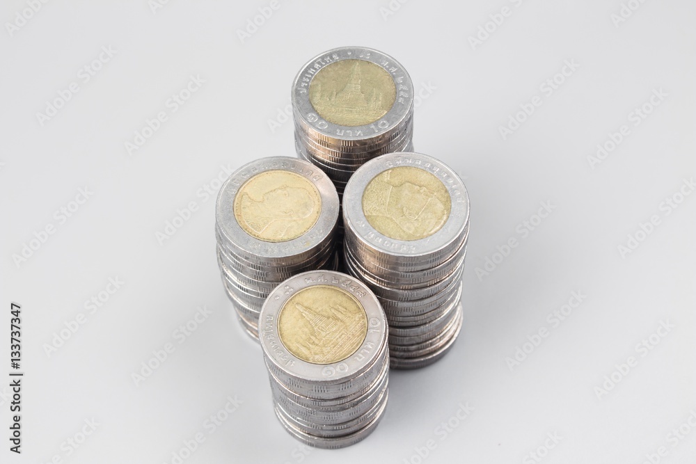 Thai baht money or Money thai coins staircase sorted on isolate on gray table. King of Thailand. The concept of financial planning, savings, Busines successful Thai baht money or Money thai coins staircase sorted on isolate on gray table. King of Thailand. The concept of financial planning, savings, Busines successful