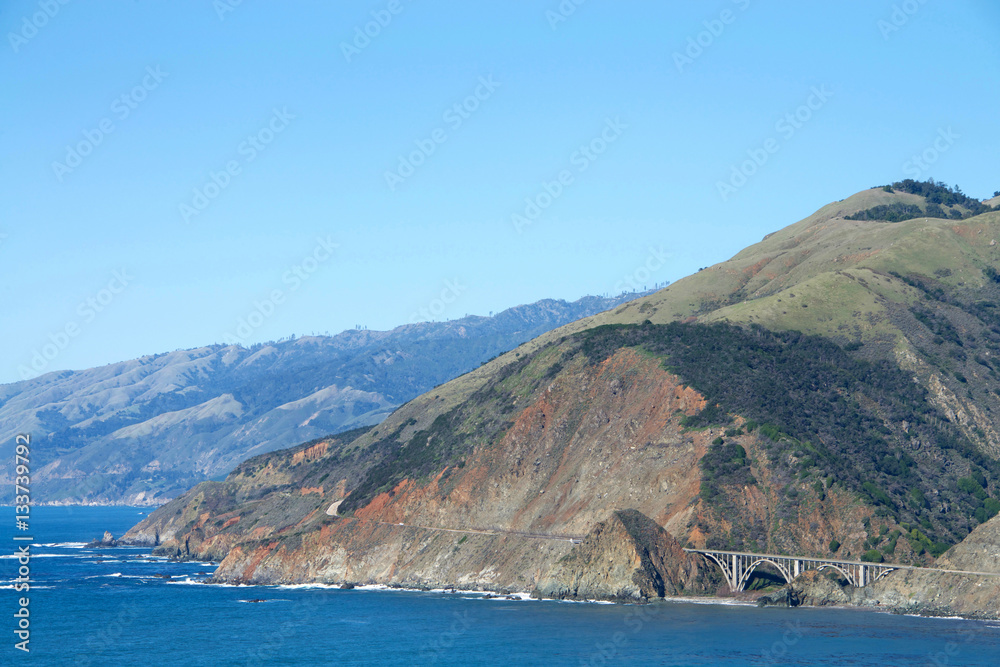 View of Pacific Coast Highway south of Big Sur with the Bixby Bridge, the most photographed bridge on the Pacific Coast.