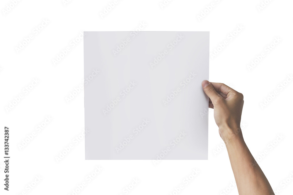 Two hands holding square paper in the right hand. Leaflet presen Two hands holding square paper in the right hand. Leaflet presen