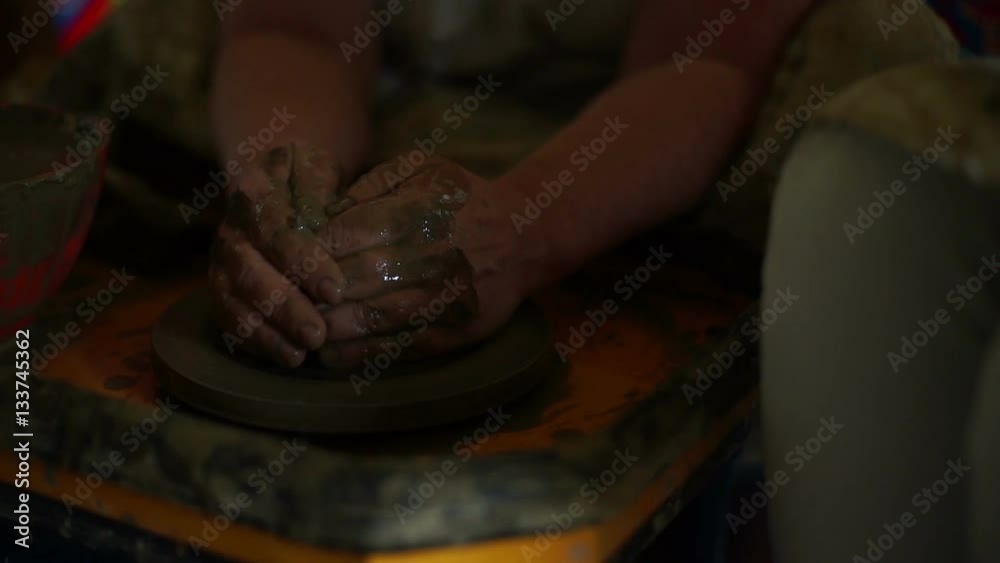 woman's hands makes a pot on pottery wheel woman's hands makes a pot on pottery wheel