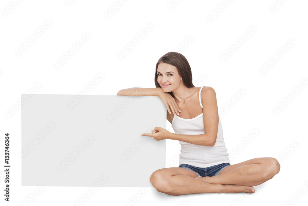 beautiful young woman smiling while leaning and presenting on bl beautiful young woman smiling while leaning and presenting on bl