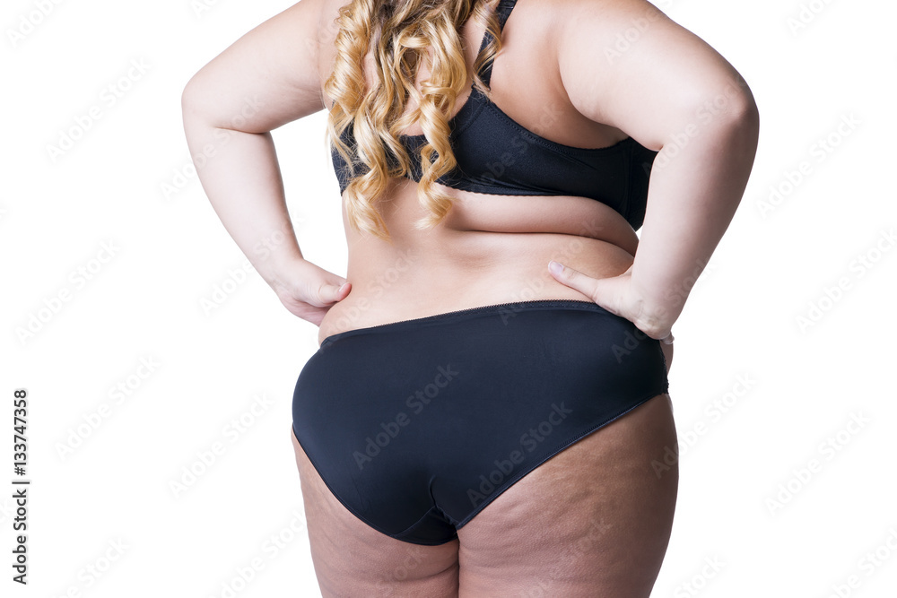 Plus size model in black lingerie, overweight female body, fat woman with  cellulitis on thighs, isolated on white background Stock Photo