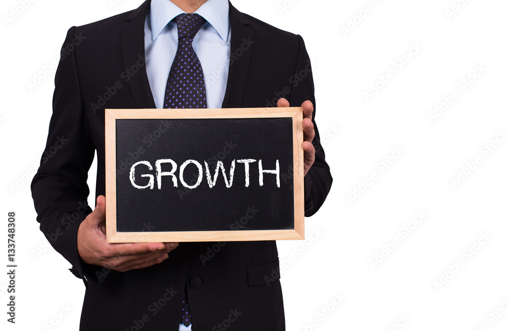 Businessman holding mini blackboard with GROWTH message Businessman holding mini blackboard with GROWTH message