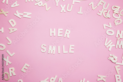 Sorting letters Her smile on pink. © Bluehousestudio