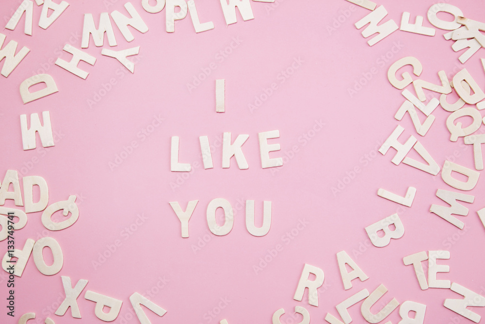 Sorting letters i like you on pink.