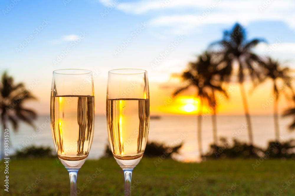 Pair of alcoholic drinks in a beautiful tropical beach setting. Relaxing beach holiday concept.