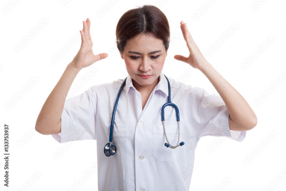 Frustrated Asian young female doctor. Frustrated Asian young female doctor.