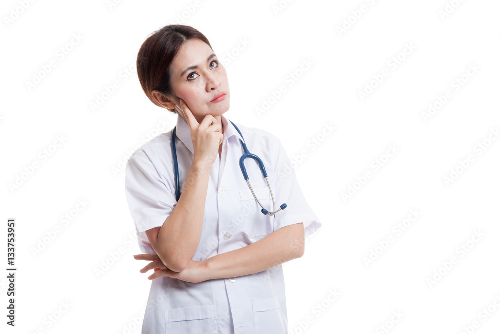 Asian young female doctor thinking looking up. Asian young female doctor thinking looking up.