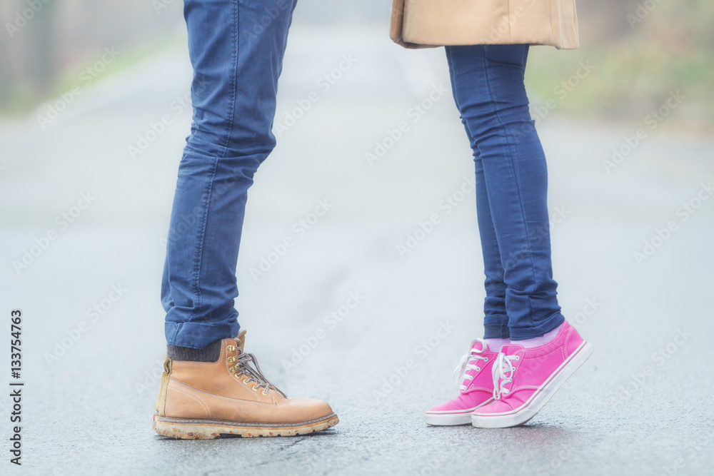 Couple in love standing in a middle of a street.