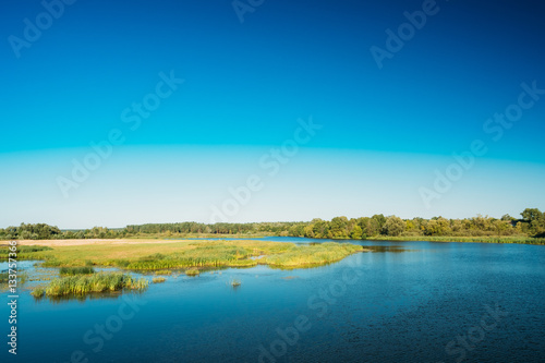 Lake Pond River At Summer Sunny Day. Nature Background. Copy Space