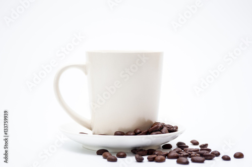 White coffee cup and coffee bean on white background.