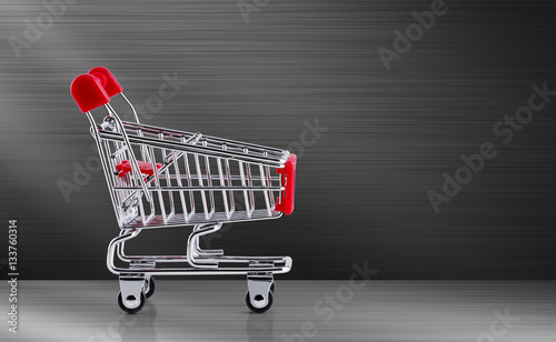 Shopping cart on metal background