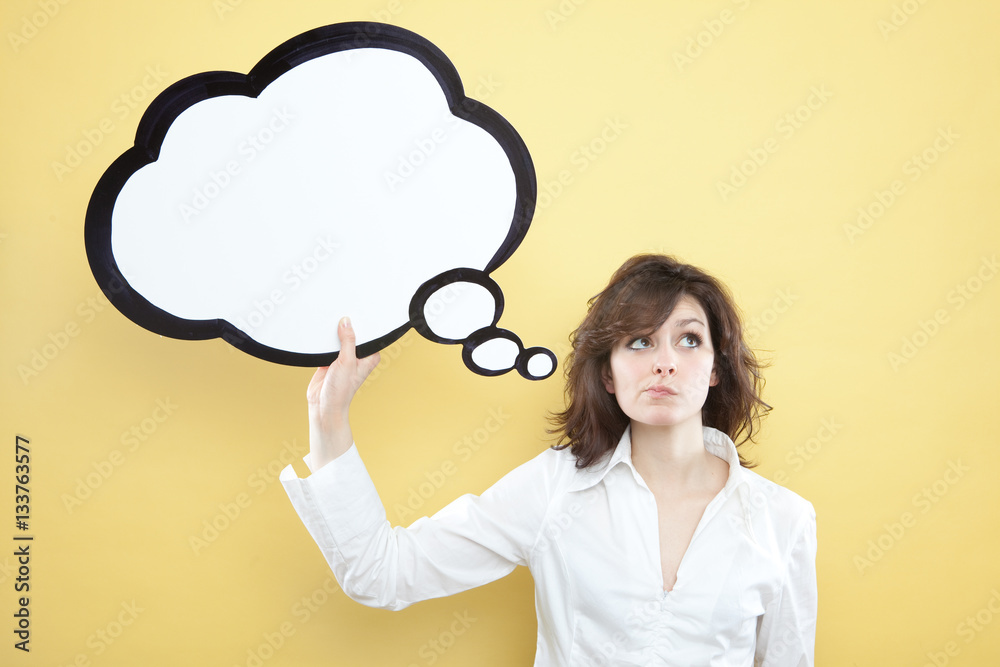 pretty young brunette caucasian woman thinking ideas with comic baloon on yellow background pretty young brunette caucasian woman thinking ideas with comic baloon on yellow background