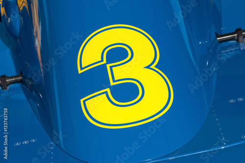 yellow number three on a race car