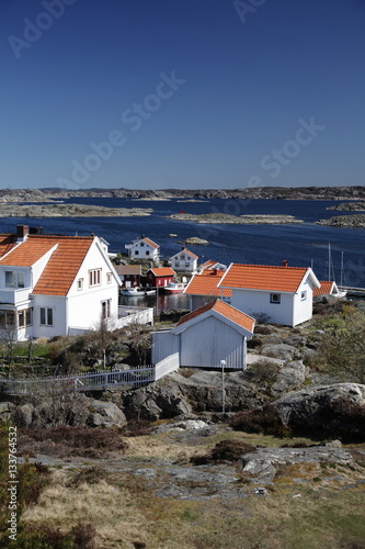 scandinavian islands view with buildings and sea photo