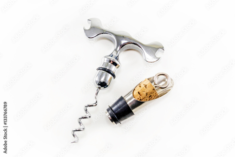 Corkscrew and wine cork isolated on white background Corkscrew and wine cork isolated on white background