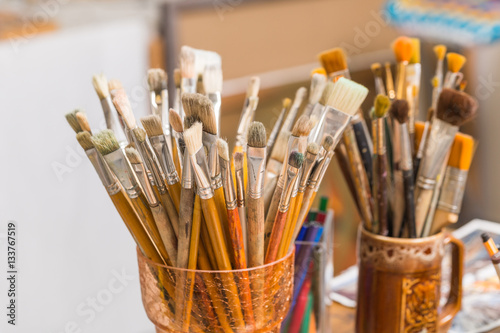 art supplies: brushes, pens, markers, paint, oil, solvent, tube