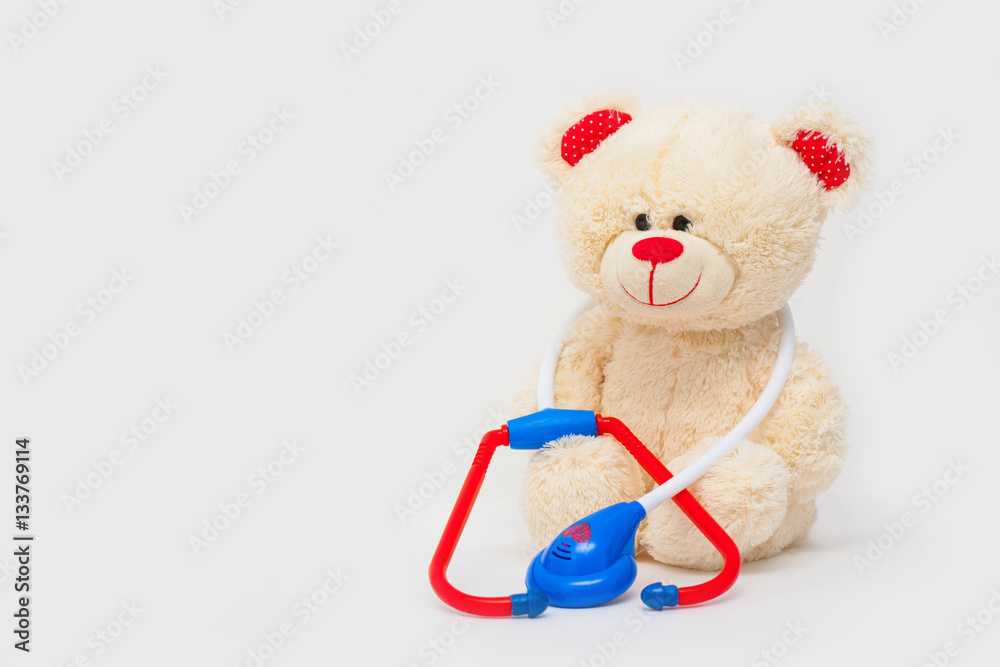 Toy white bear with stethoscope isolated Toy white bear with stethoscope isolated