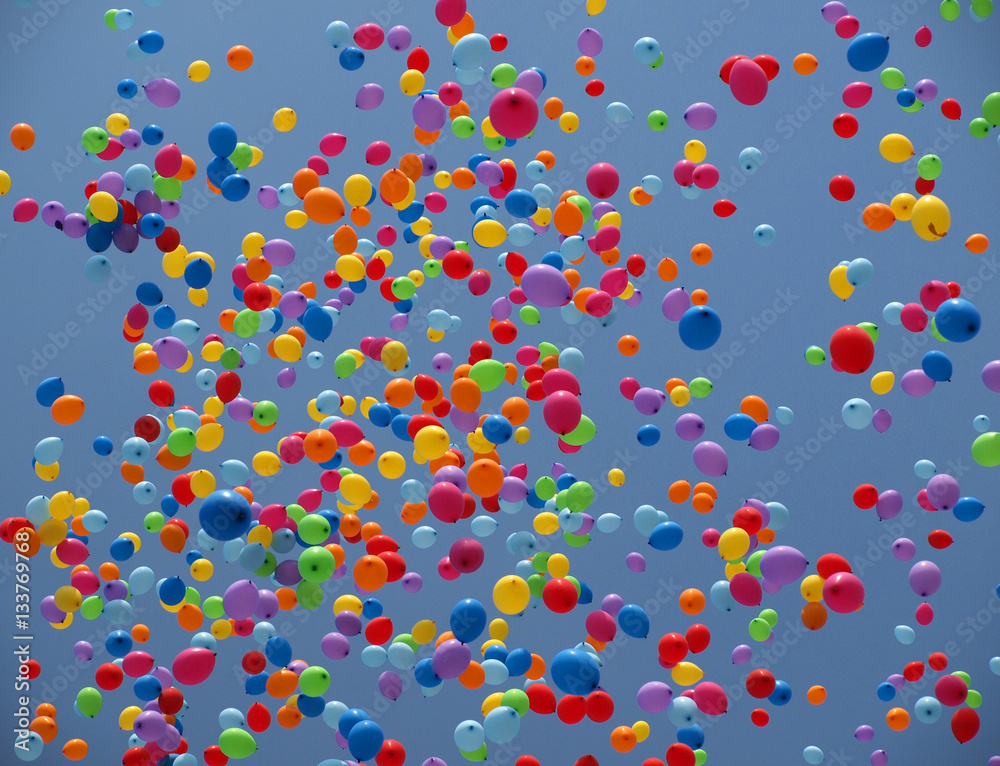 Multi colored balloons on a blue sky - obrazy, fototapety, plakaty 