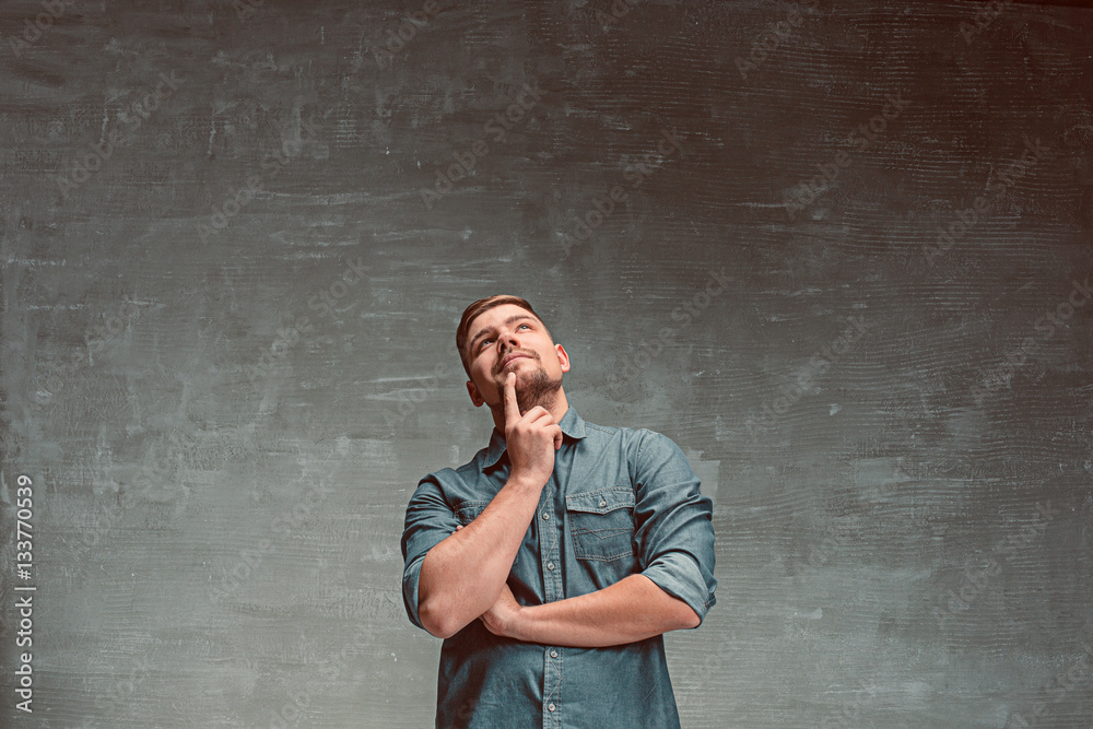 Portrait of smiling happy man standing in studio Portrait of smiling happy man standing in studio