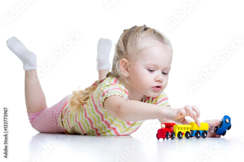 Cute little girl playing tr...