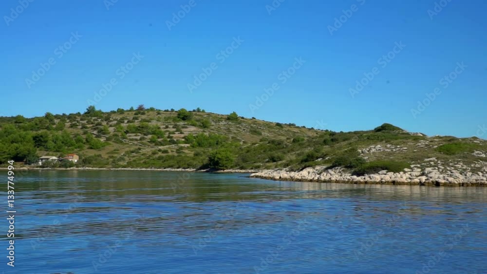 We can see a beautiful green island and there is a lot of vegetation on it. We don't see any people anywhere.
We can see a beautiful green island and there is a lot of vegetation on it. We don't see any people anywhere.