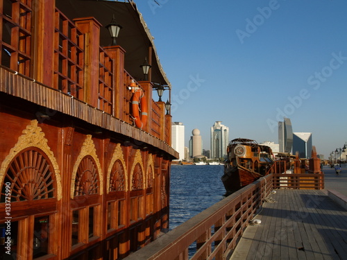 Dubai Creek, traditional wooden ship, dhow, national bank, Unite photo