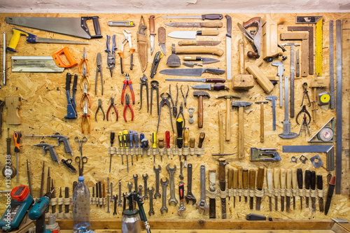 work tools hanging on wall at workshop