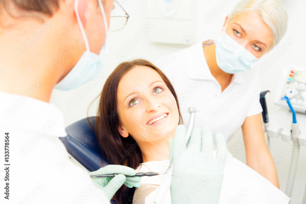 Young Woman Getting A Treatment At The Dentist Young Woman Getting A Treatment At The Dentist