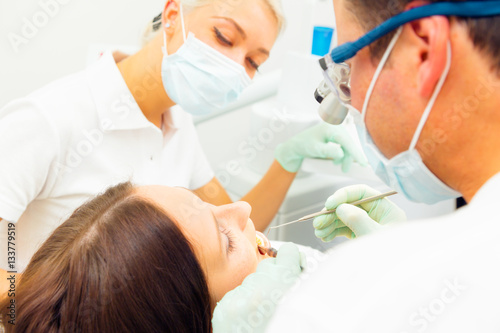 Young Woman Getting A Treatment At The Dentist