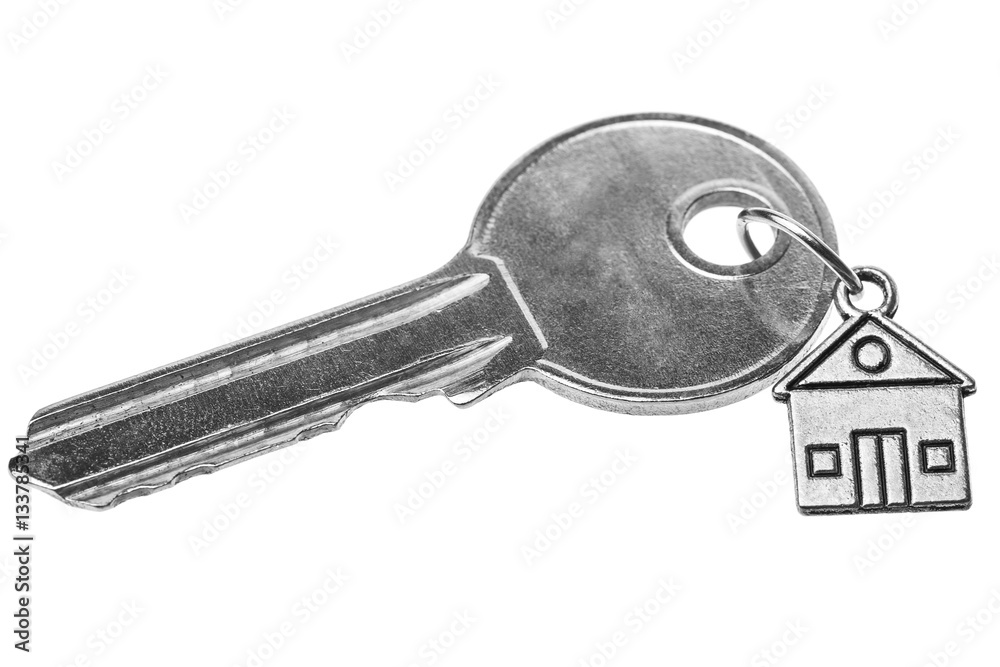 Key on a charm with the house. Key on a charm with the house.