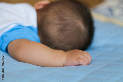 Sleeping baby's hand photo