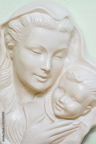 Ceramic sculpture of a mother and child.