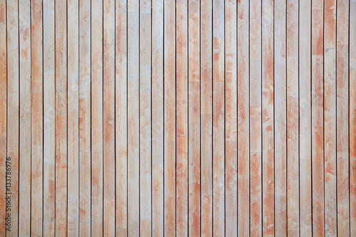 Red wooden background. Textured rustic planks vertically disposed.