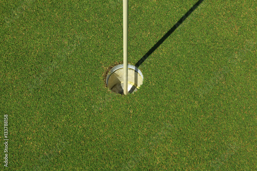 Hole on green in golf course