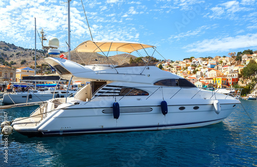 luxury yacht docked in the marina of Simi island.