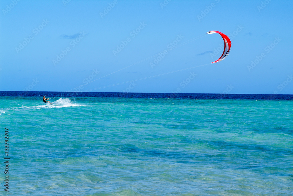 Man practicing kitesurf on Mayotte island, France Man practicing kitesurf on Mayotte island, France