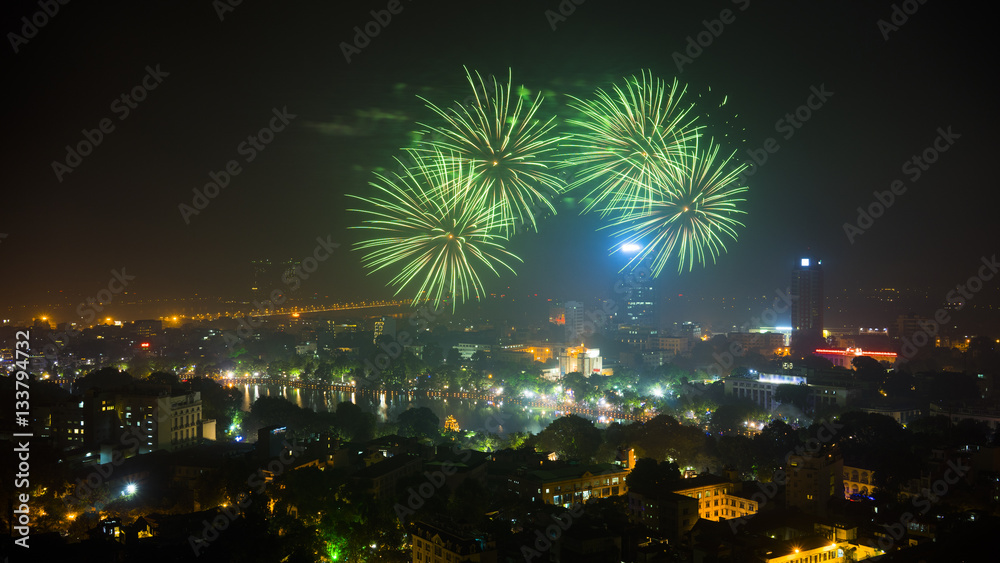 Fototapeta premium Firework on Hanoi liberation 60th day at Hoan Kiem lake, Hanoi, Vietnam