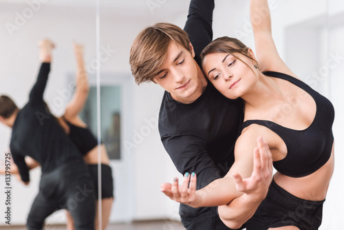 Professional masterful dancers looking at the hands