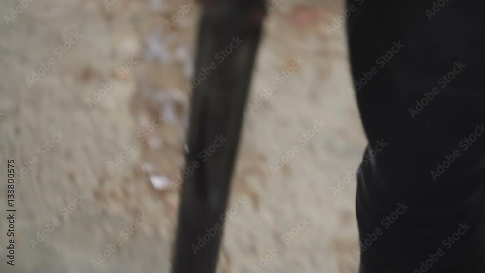 Young man with a gun close-up Young man with a gun close-up
